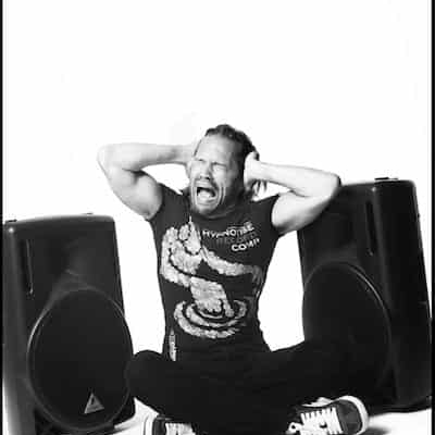 DJ screaming with speakers